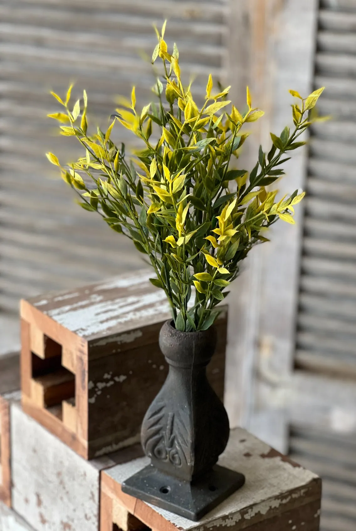 Artificial greenery bush with warm yellow tips